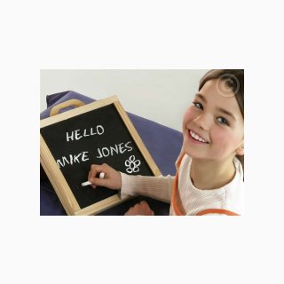 Little Girl Writing on Wooden Board